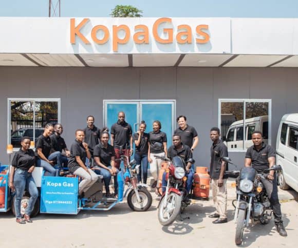 The KopaGas team stands outside their office in Dar es Salaam, Tanzania. 