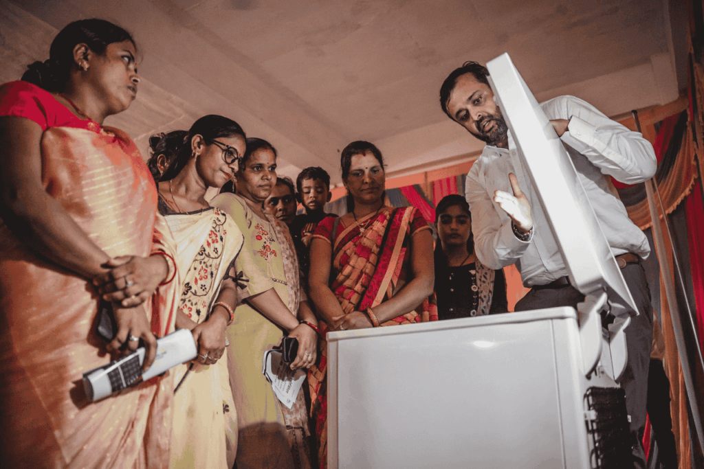 People gathered around cooler