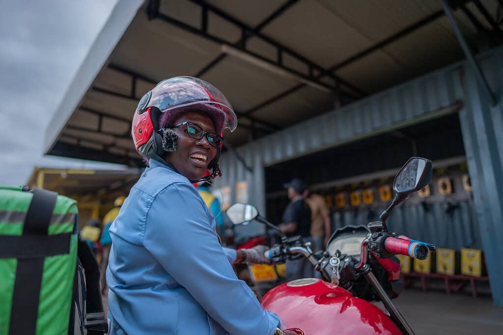 Motorcyclist sits idly outside of Ampersand service center