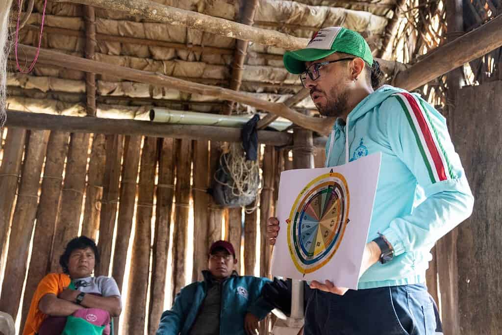 Acumen Fellow Diego Moreno speaking with rural Colombian village members