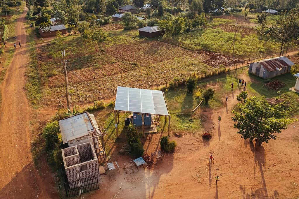Aerial shot of solar panel array on a small rural East African farm