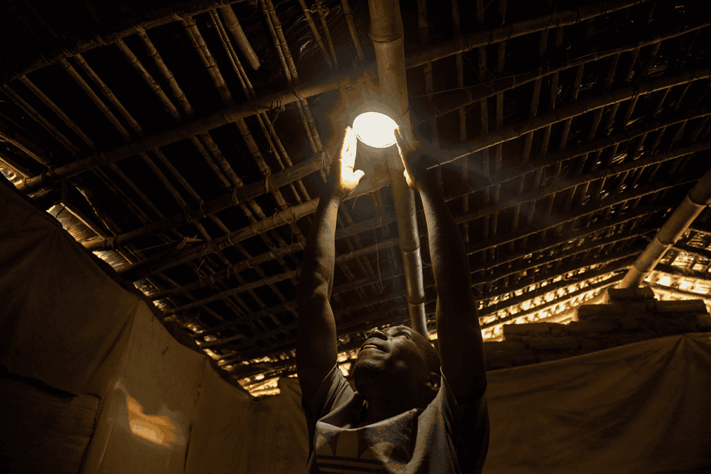 Man reaching up for light bulb