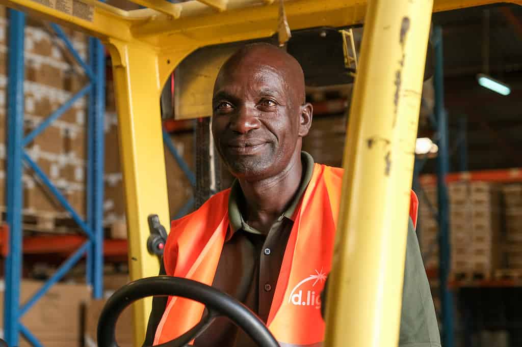 Worker operates a forklift in a warehouse
