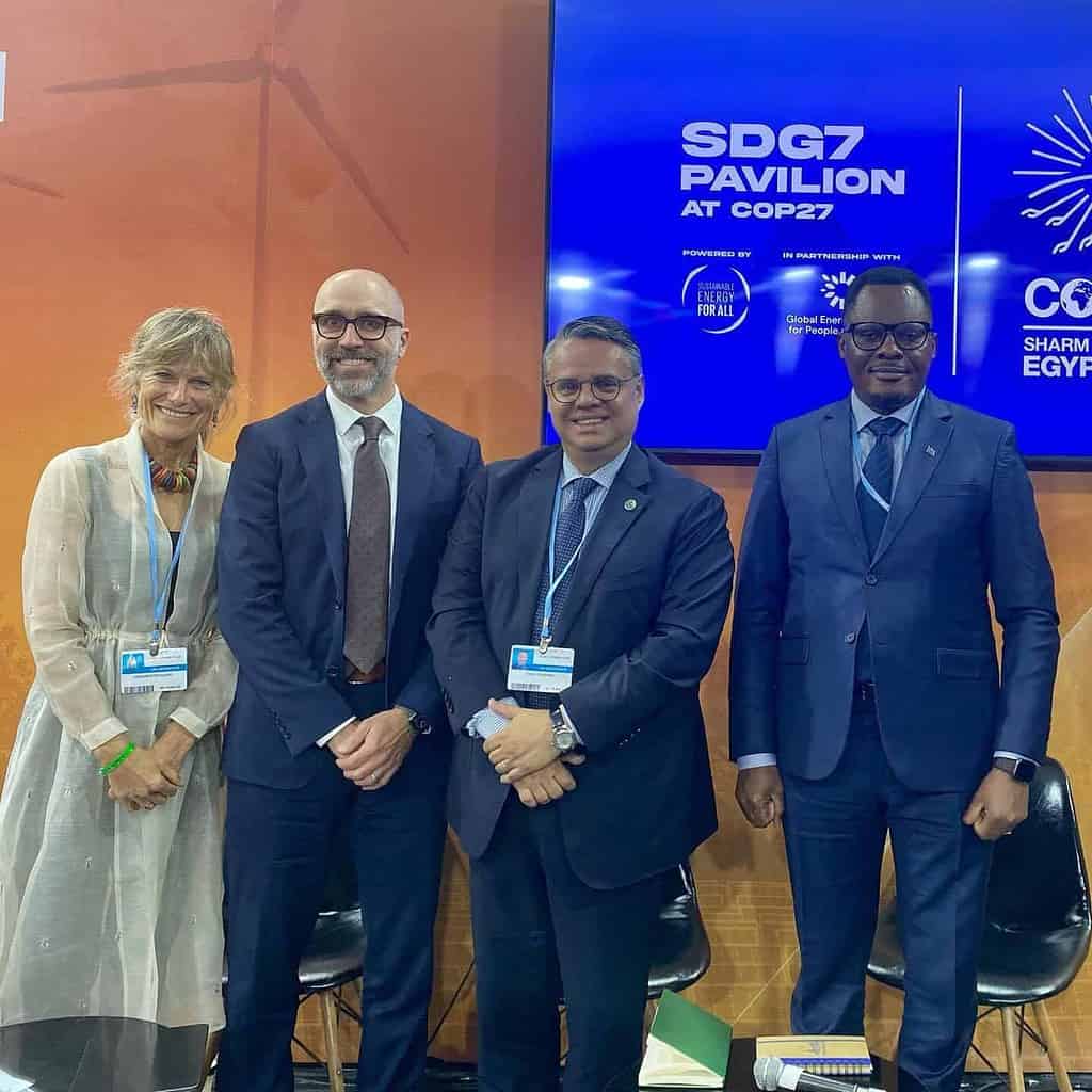 Jacqueline on stage with panelists at COP27