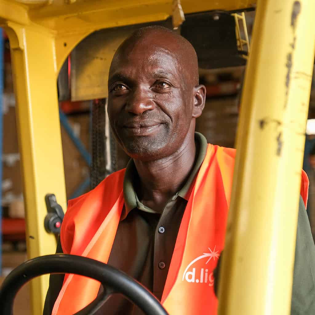 Worker operates a forklift in a warehouse