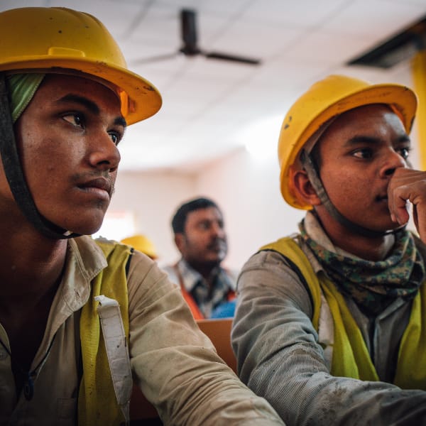 Workers sit in classroom prepared for workforce development seminar