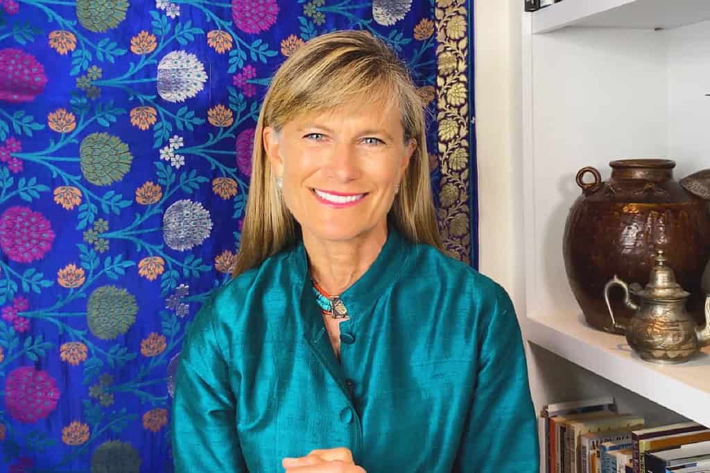 Jacqueline Novogratz smiles while delivering virtual TED talk