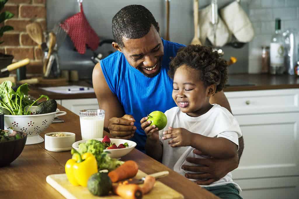 Dad and son cooking together.
