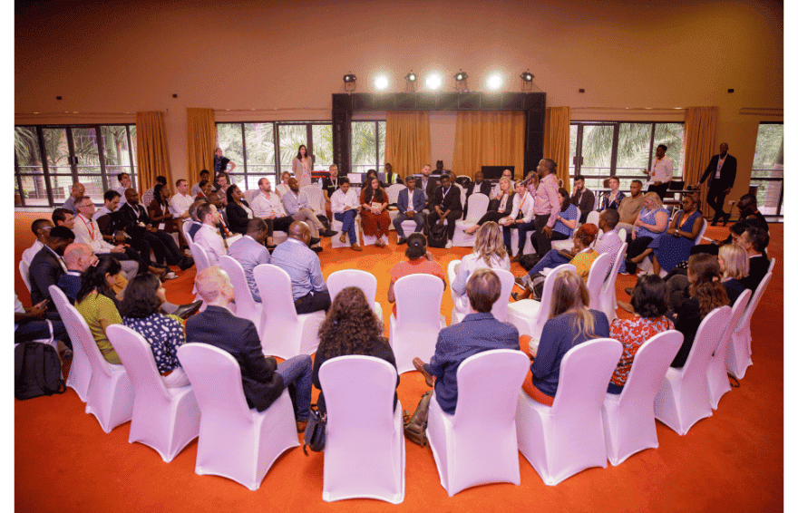 Attendees gathered in chairs at an event