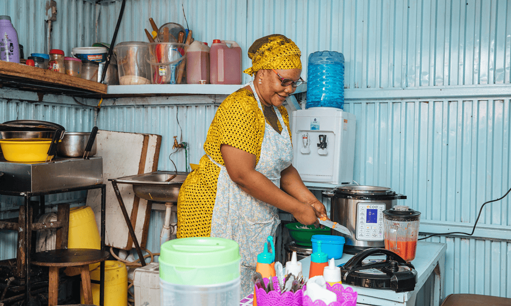 Woman cooking on cookstove