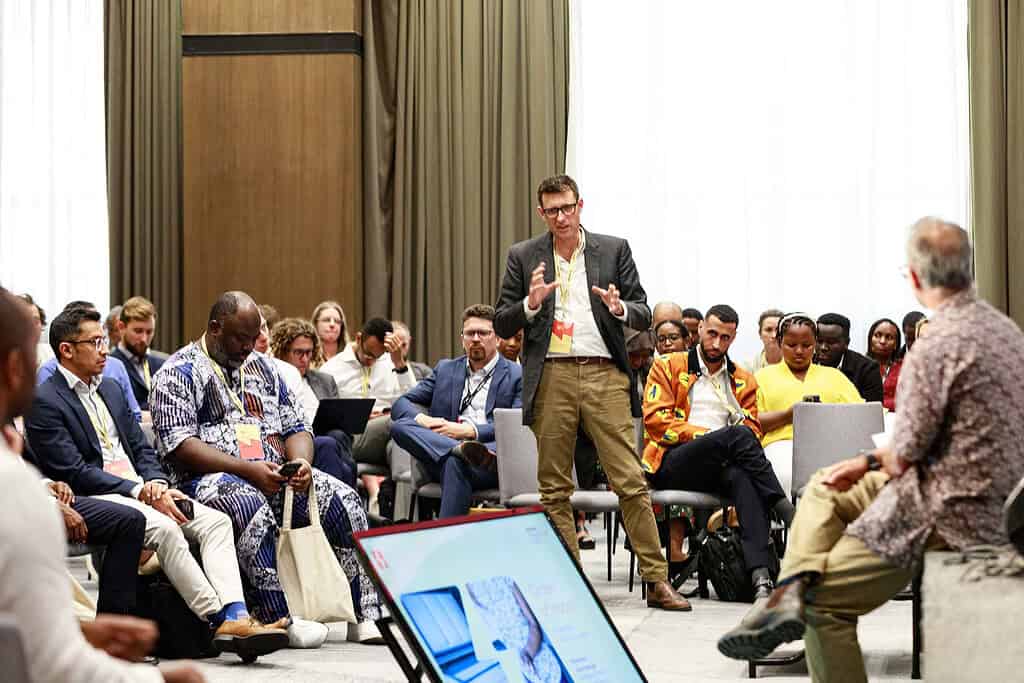 Man speaks at Acumen Energy Summit 2025 session