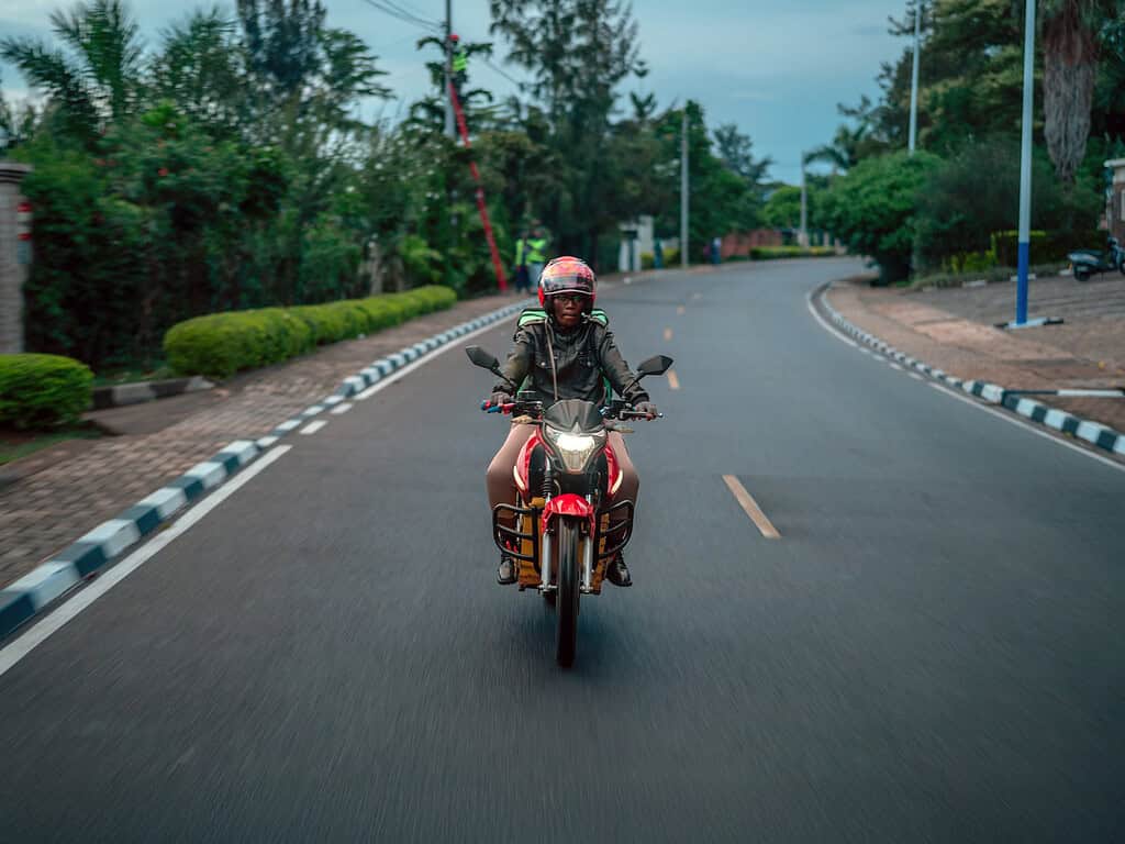 A woman drives an Ampersand e-moto