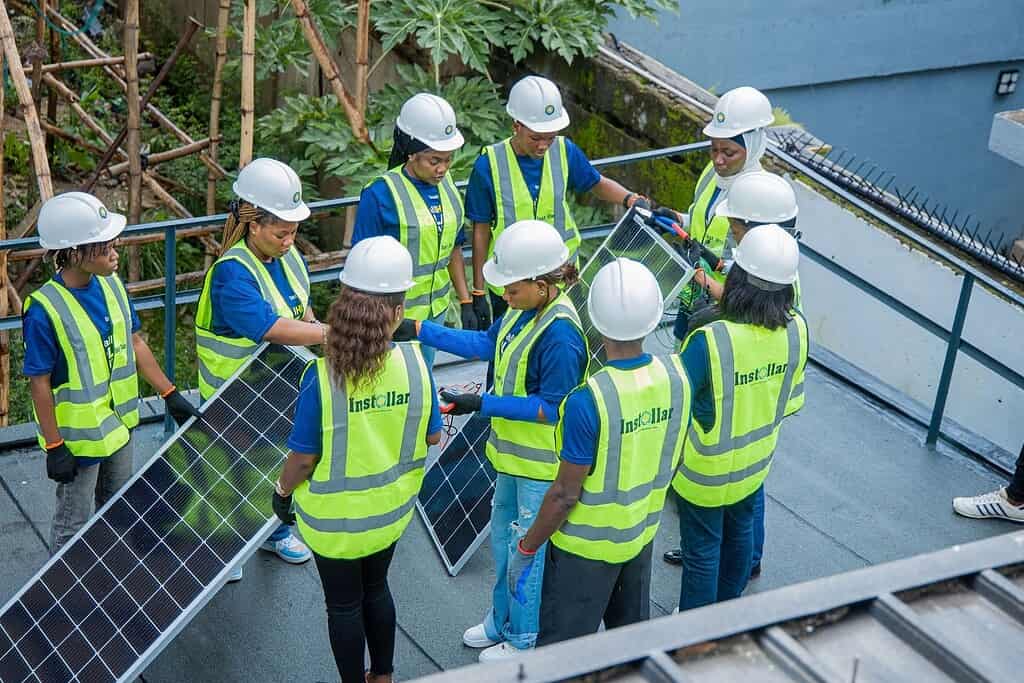 Instollar workers with solar panel